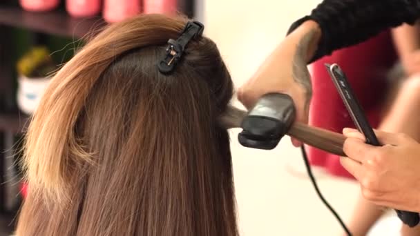 stock-video-girl-hairdresser-makes-client-keratin